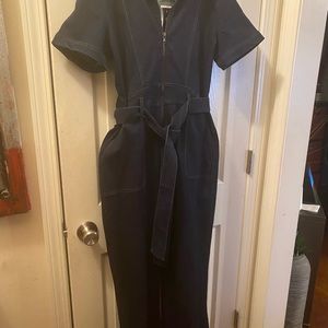 NWT blue denim jumpsuit.   Size women’s large